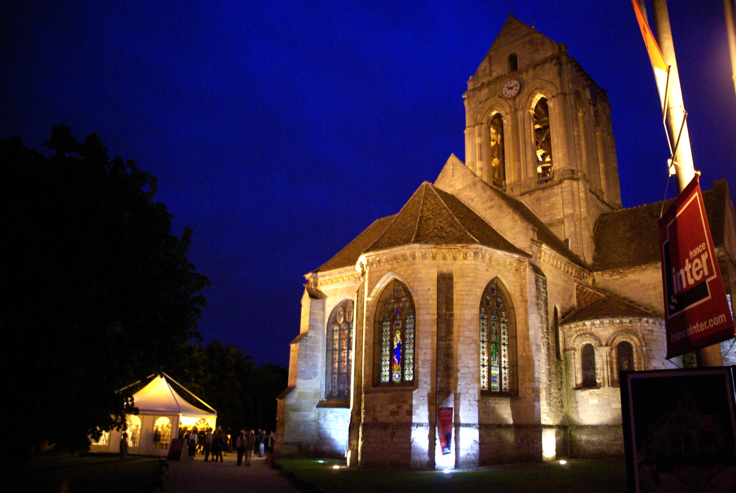 The church of Auvers-sur-Oise illuminated during a Festival Opus