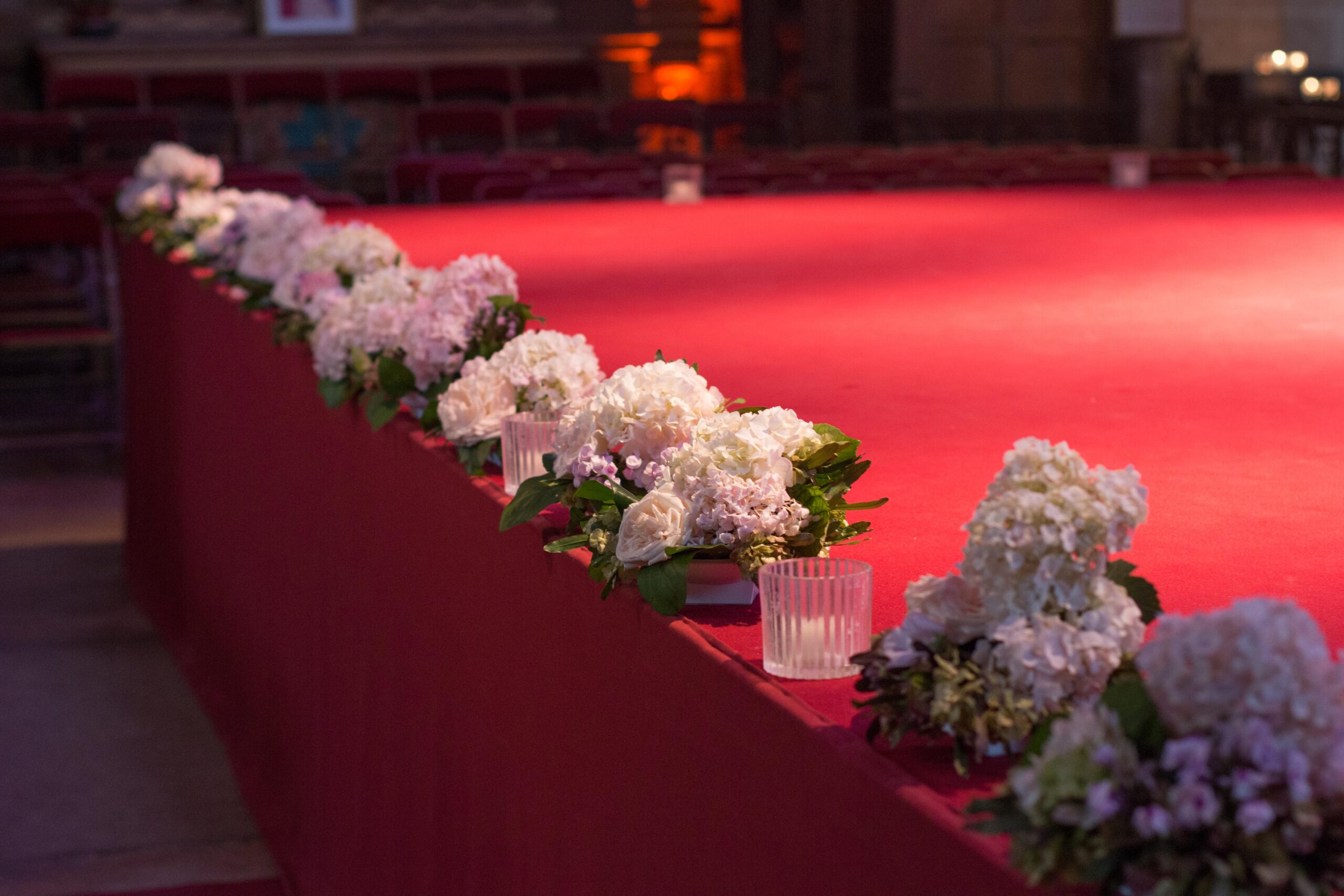 Flower-decked stage inside the church during the Festival d'Auvers-sur-Oise